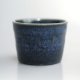 Deep blue 50ml stoneware cup with a ripple glaze.