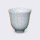 Stylish shell pattern Dehua Porcelain teacup in a light blue glaze.